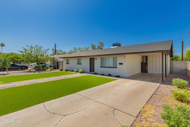 915 E Commonwealth Pl, Chandler, AZ 85225 - ranch-style home with a carport, driveway, roof with shingles, and board and batten siding