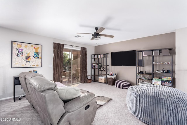 carpeted living room with ceiling fan