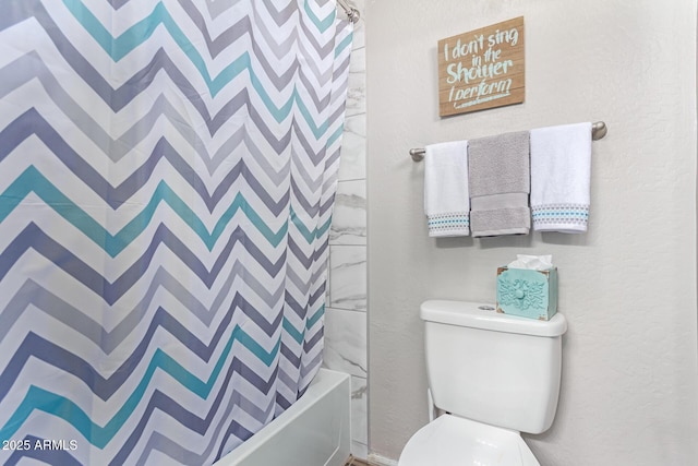 bathroom with toilet and shower / tub combo with curtain