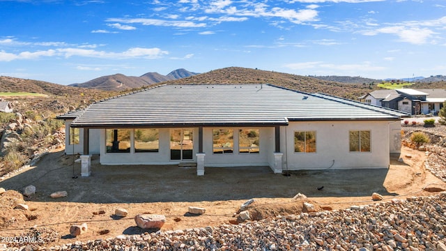 rear view of property with a mountain view