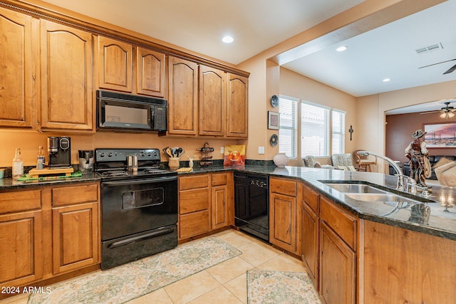 kitchen with sink, black appliances, dark stone counters, kitchen peninsula, and ceiling fan