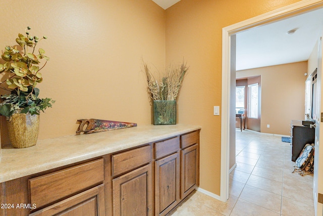 hallway with light tile patterned flooring