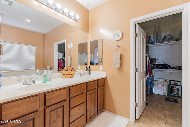 bathroom with vanity and tile patterned flooring