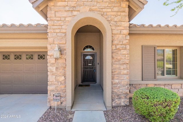 entrance to property with a garage