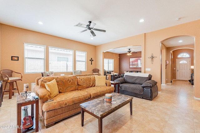 living room with ceiling fan and light tile patterned floors