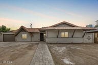 single story home featuring driveway