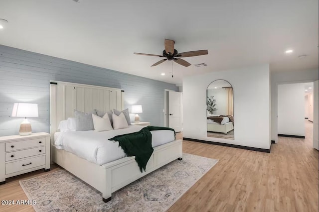 bedroom with ceiling fan and light wood-type flooring