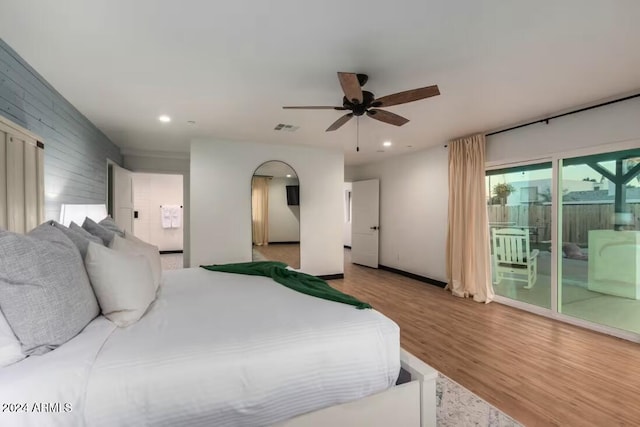 bedroom with ceiling fan, hardwood / wood-style flooring, and access to exterior