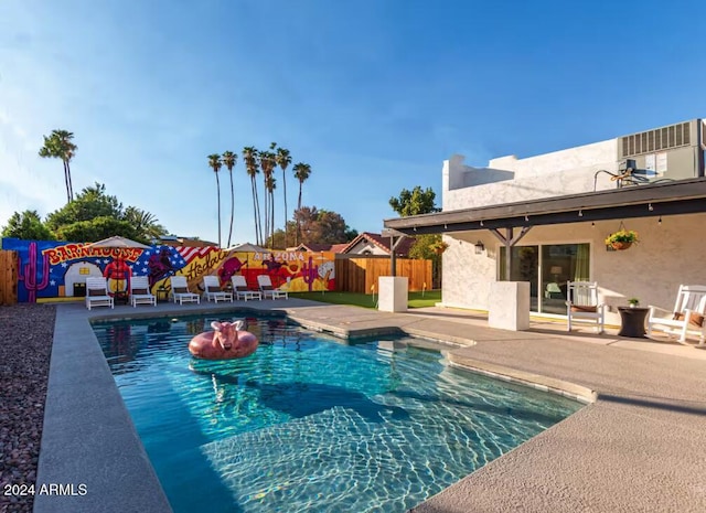 view of swimming pool with a patio