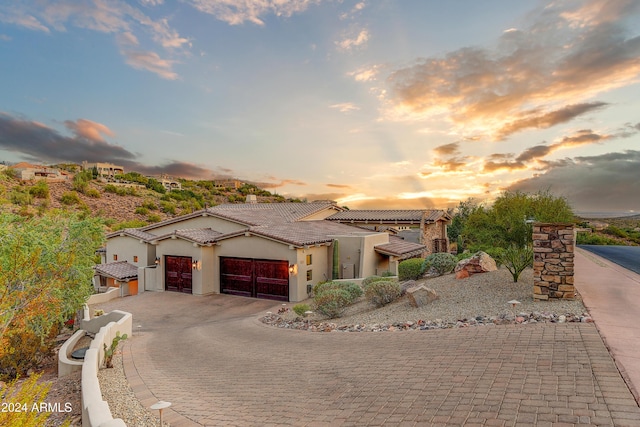 mediterranean / spanish-style house featuring a garage