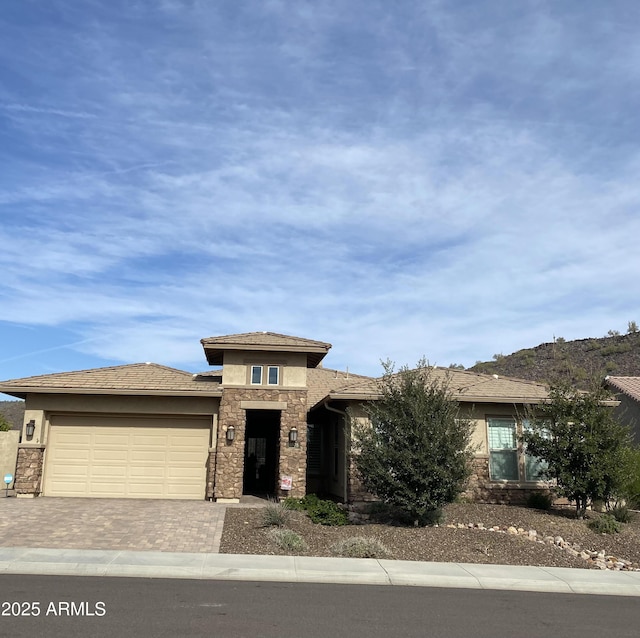 prairie-style home featuring a garage