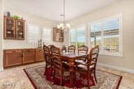 dining space with a notable chandelier