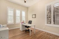 office space with hardwood / wood-style floors