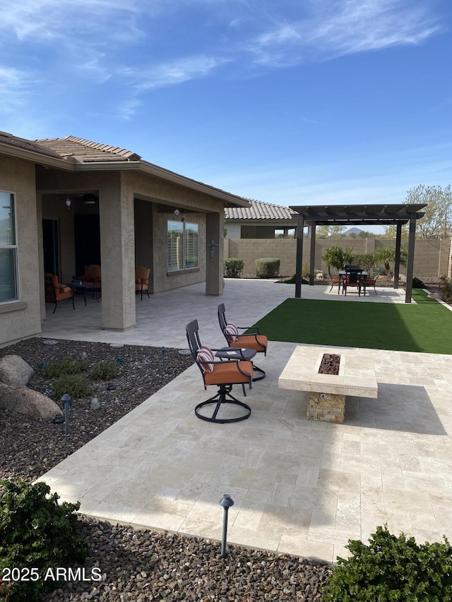 view of patio / terrace featuring a pergola and an outdoor fire pit