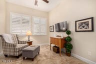 living area featuring ceiling fan