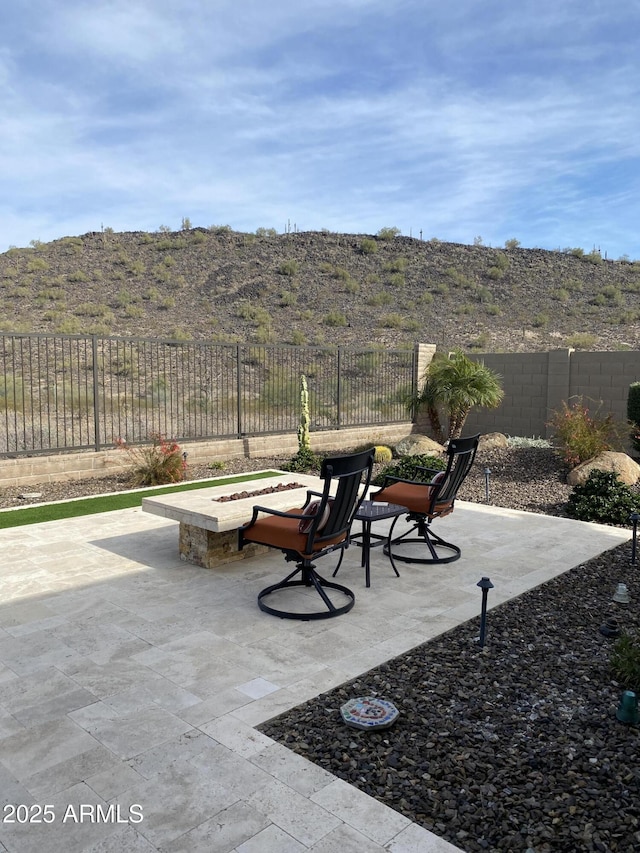 view of patio / terrace with a mountain view