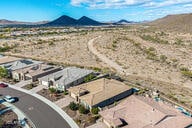 birds eye view of property featuring a mountain view