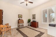 living area with ceiling fan