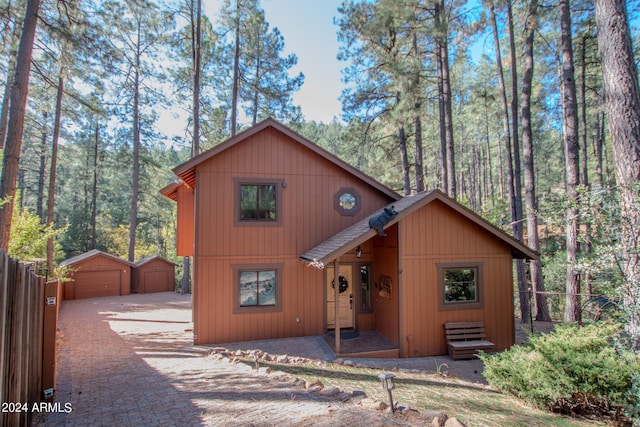 front of property featuring an outdoor structure and a garage