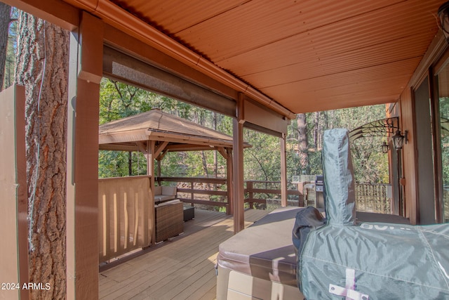 wooden deck featuring a gazebo