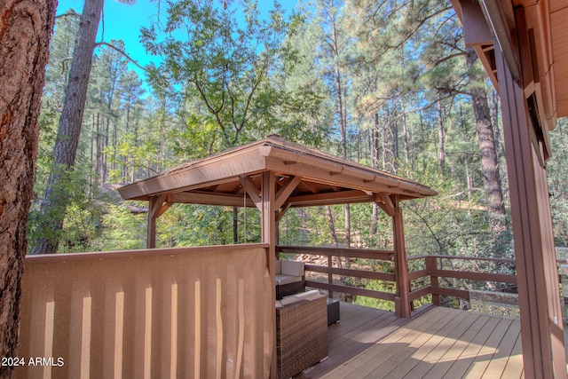 wooden terrace featuring a gazebo