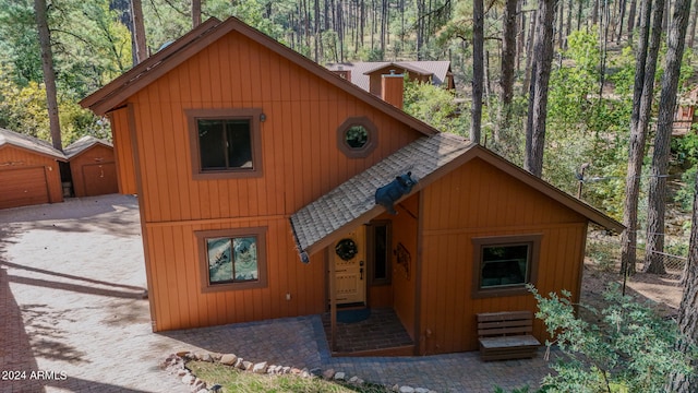 view of front facade with an outbuilding and a garage