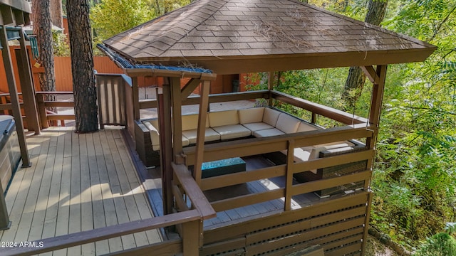 wooden deck featuring a gazebo