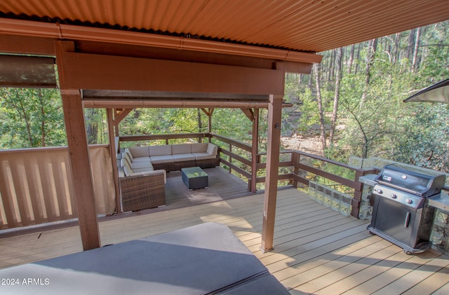 deck featuring an outdoor hangout area and a grill