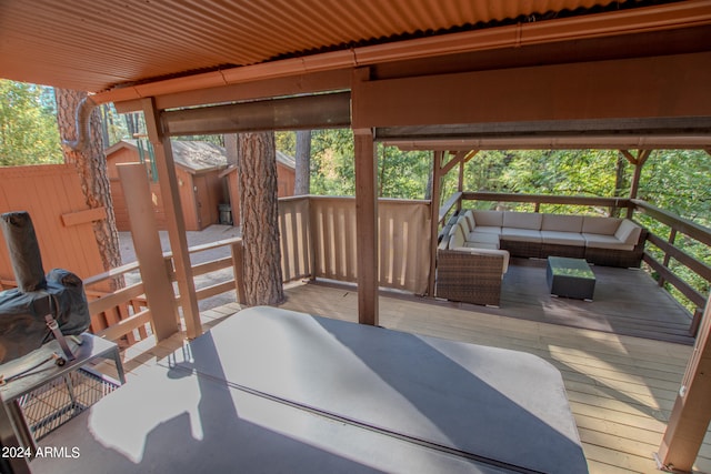 wooden terrace featuring an outdoor living space