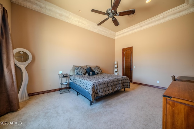 carpeted bedroom featuring ornamental molding, a ceiling fan, visible vents, and baseboards