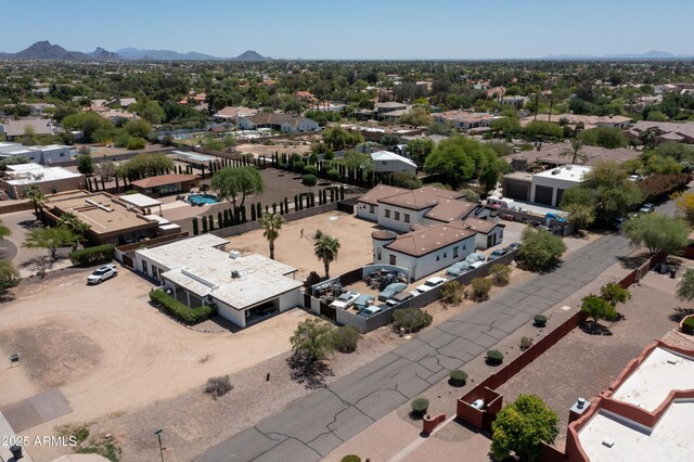 birds eye view of property with a mountain view and a residential view