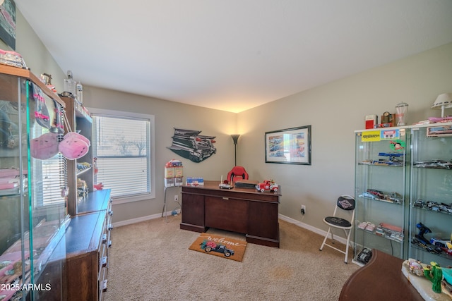 carpeted office space featuring baseboards