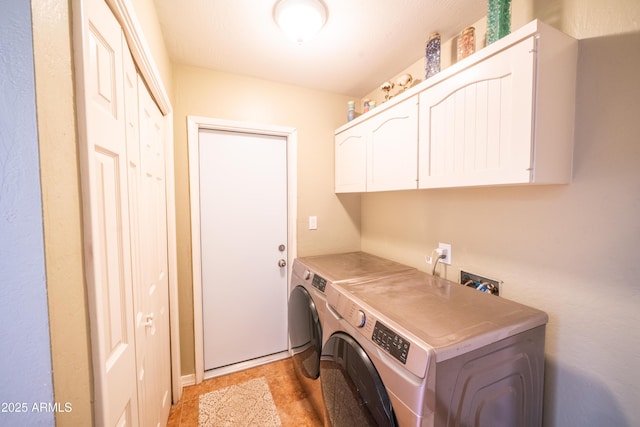 laundry area with cabinet space and washing machine and dryer