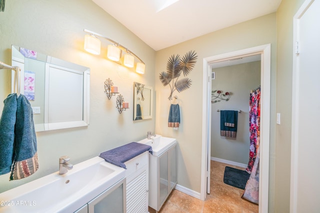 full bath with vanity and tile patterned flooring
