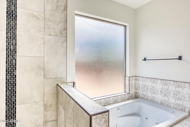 bathroom with tiled tub