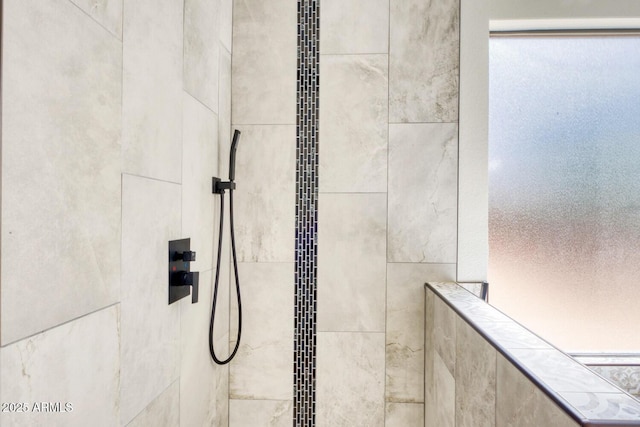 details featuring a tile shower