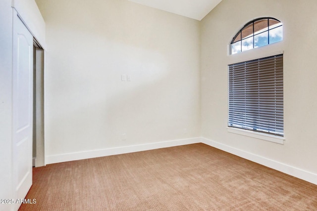 unfurnished room featuring carpet