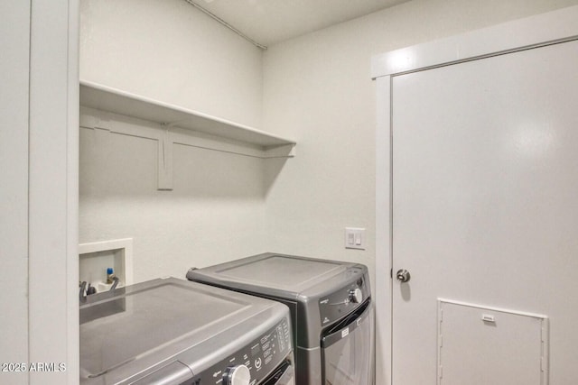 clothes washing area with independent washer and dryer