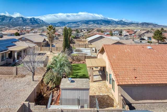 birds eye view of property featuring a mountain view