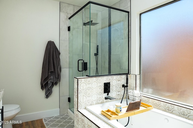 bathroom featuring wood-type flooring, toilet, and plus walk in shower