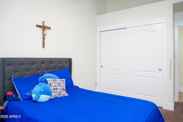 carpeted bedroom featuring a closet