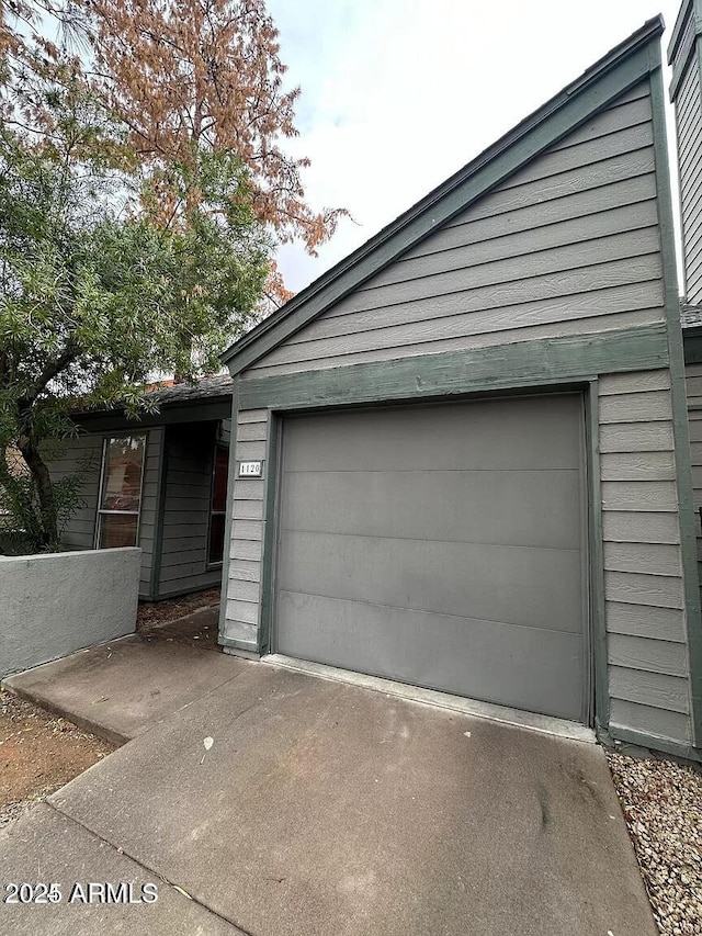 14002 N 49th Ave Unit 1120, Glendale, AZ 85306 - garage featuring driveway