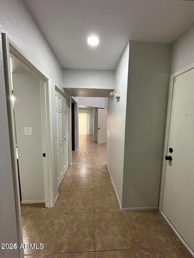 14002 N 49th Ave Unit 1120, Glendale, AZ 85306 - hallway with tile patterned floors and baseboards