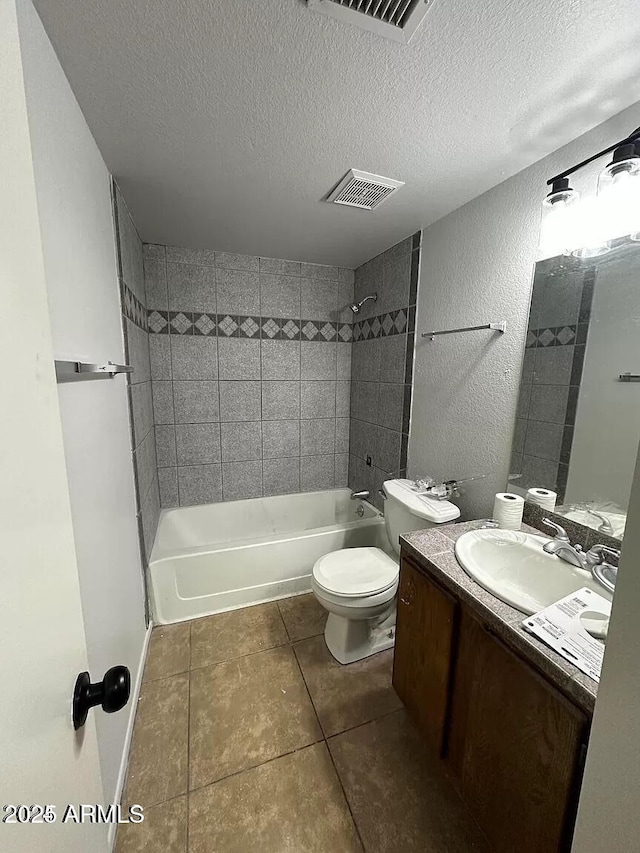 14002 N 49th Ave Unit 1120, Glendale, AZ 85306 - bathroom with bathtub / shower combination, tile patterned flooring, a textured ceiling, toilet, and double vanity