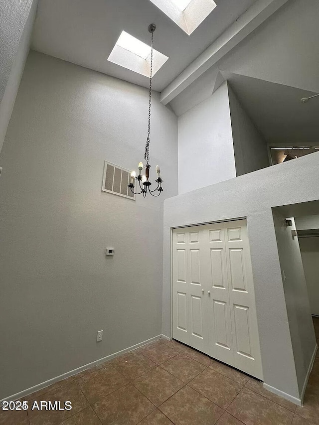 14002 N 49th Ave Unit 1120, Glendale, AZ 85306 - detailed view of a skylight, a chandelier, and baseboards