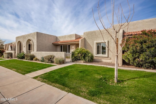 southwest-style home with a front yard