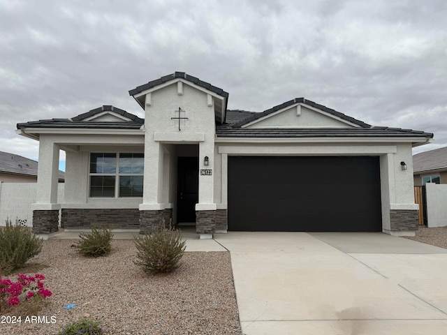 view of front of home with a garage