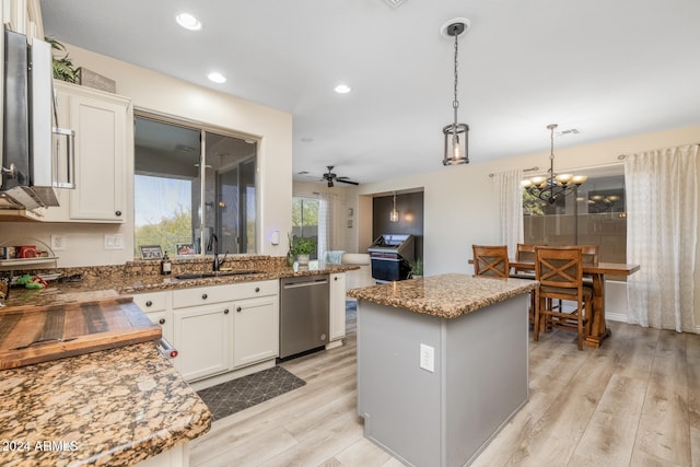 kitchen with white cabinetry, sink, light hardwood / wood-style floors, and dishwasher