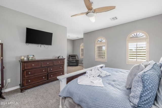 bedroom featuring ceiling fan and light colored carpet