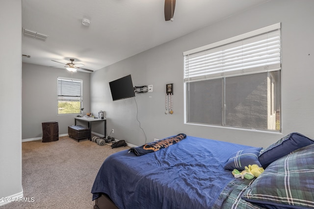 carpeted bedroom featuring ceiling fan